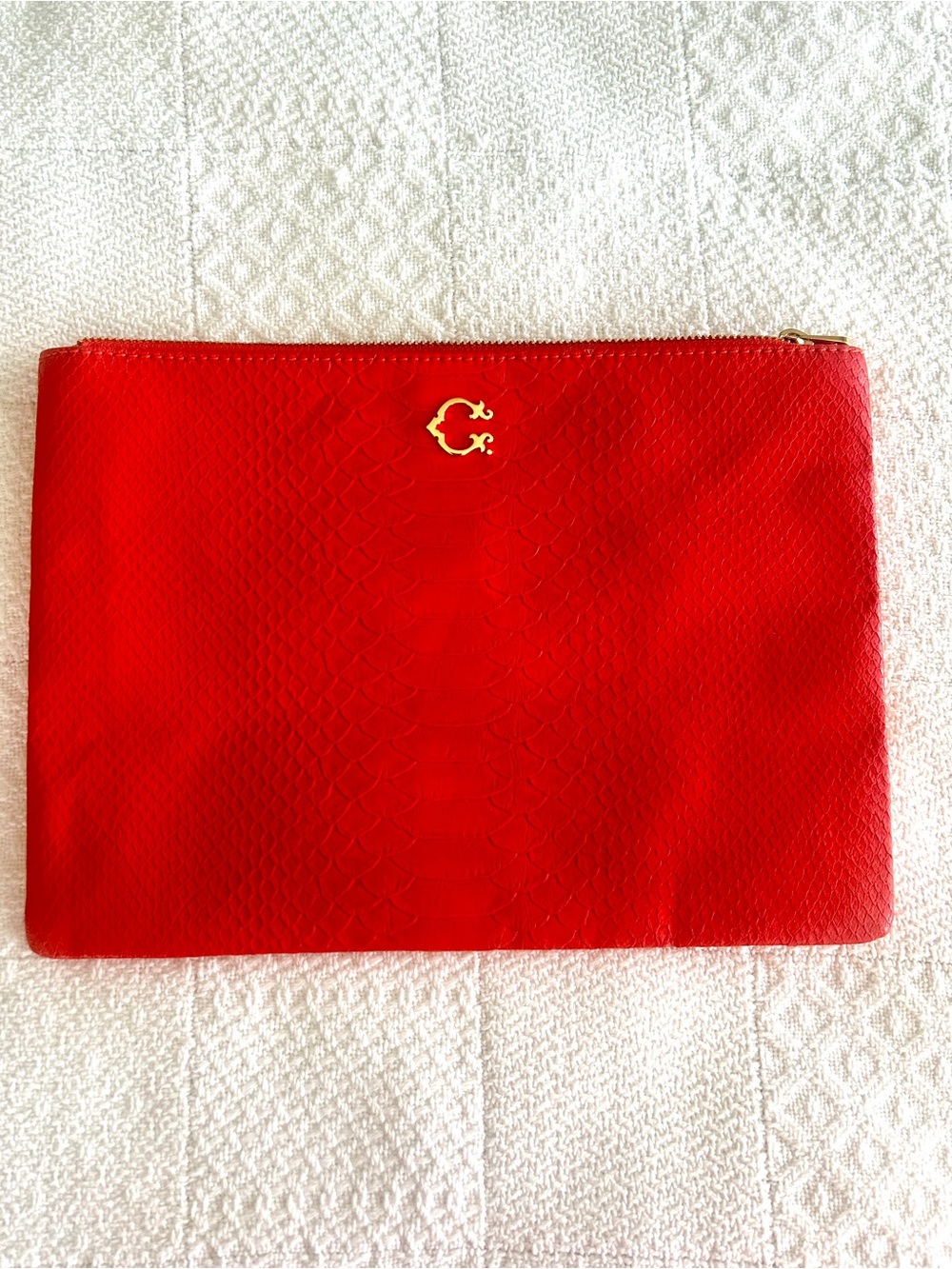 C. Wonder Clutch Orange Red Embossed Print Zip Close with Gold C Emblem